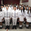 Alumnos entonando el himno del renombrado colegio de la capital.